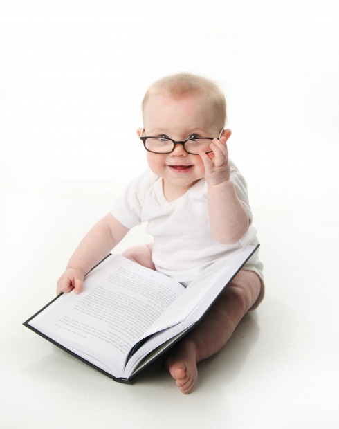 Baby reading wearing glasses